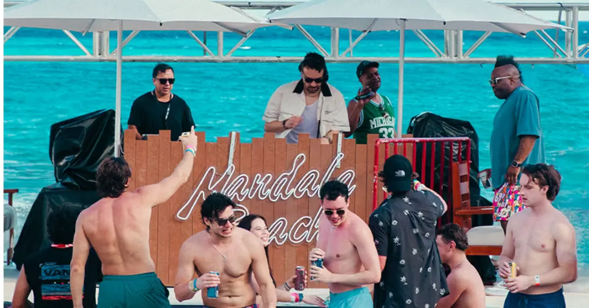 Daybeds and palms at Mandala Beach day club in Cancun